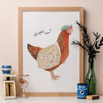 Alright Hen Print on shelf with kitchen scales and cut foliage
