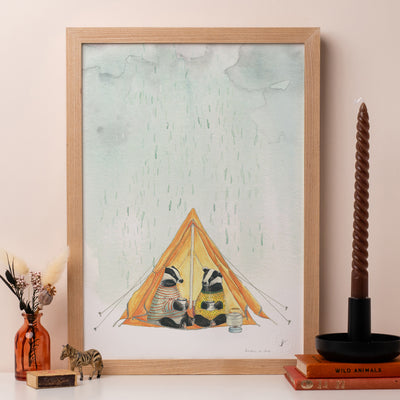 Weather or not print of badgers camping in a tent in the rain framed