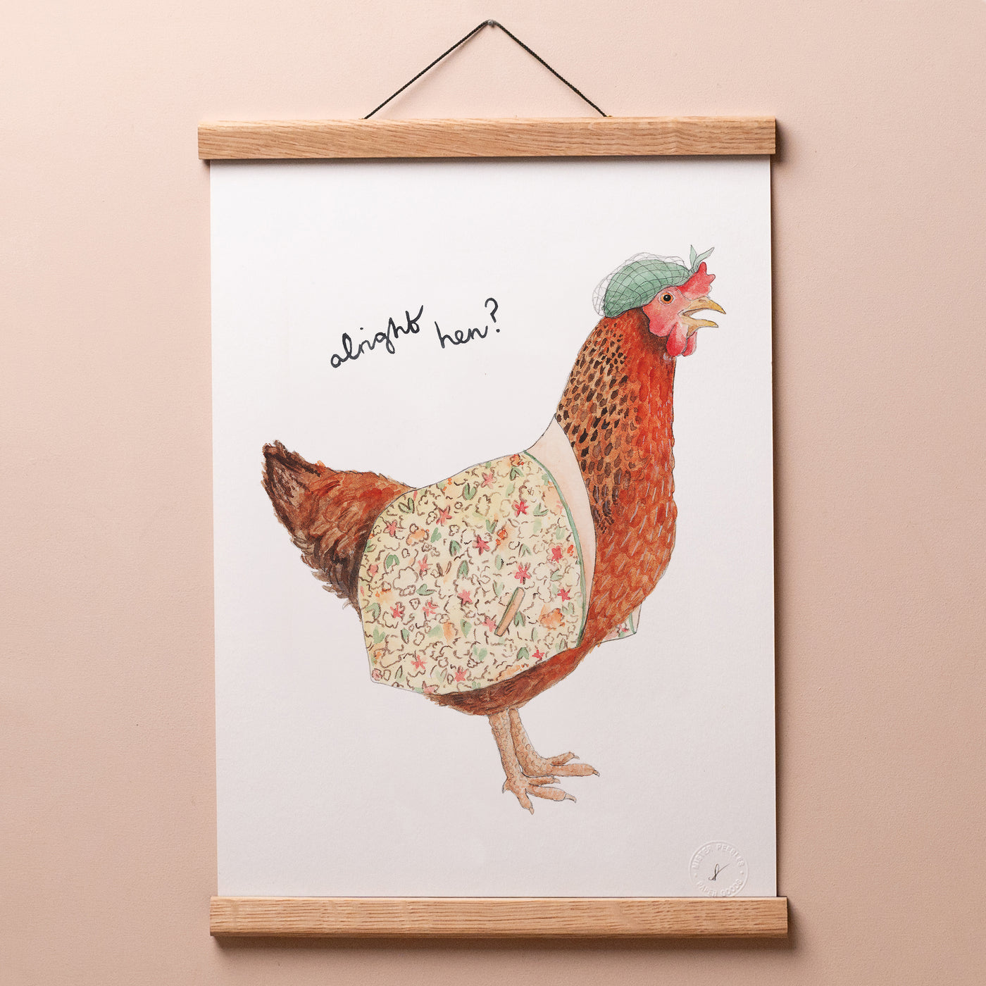 Alright Hen print in a wooden hanger frame on a pink wall