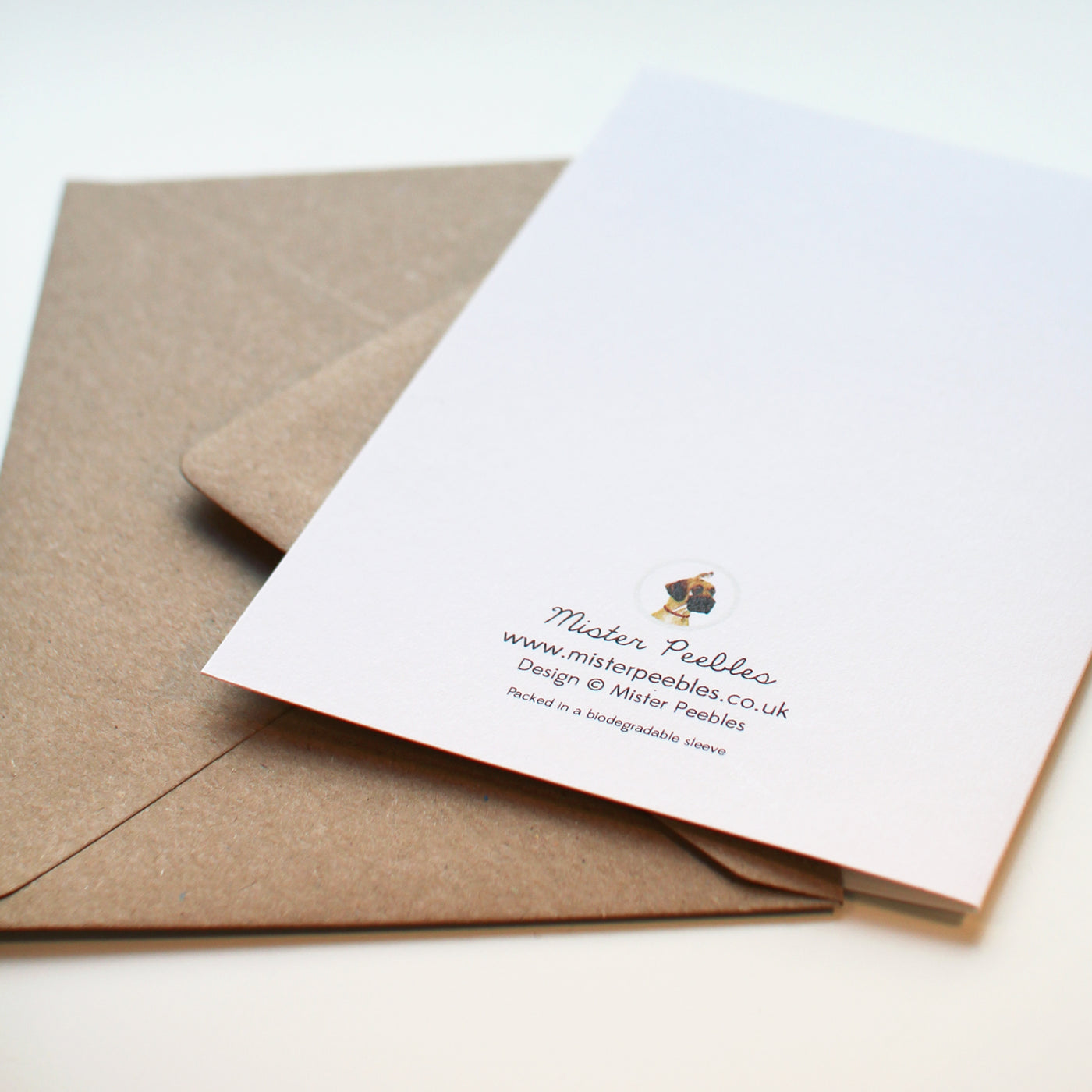 Reverse of the greetings card showing logo and packed in a biodegradable sleeve