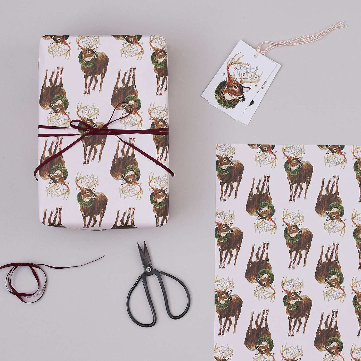 Christmas Deer Wrapped Gift and matching gift tags with stripy string
