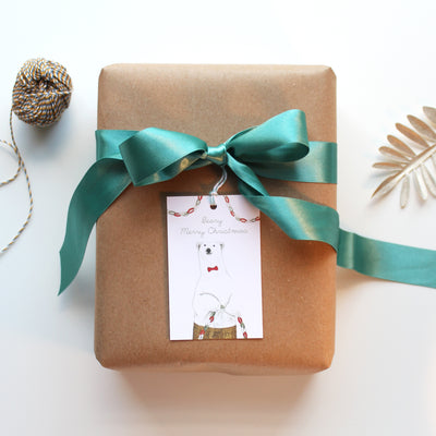 Wrapped gift with polar bear Christmas gift tag